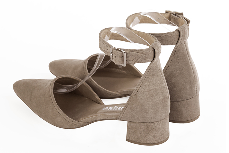 Tan beige women's open side shoes, with a strap around the ankle. Tapered toe. Low flare heels. Rear view - Florence KOOIJMAN